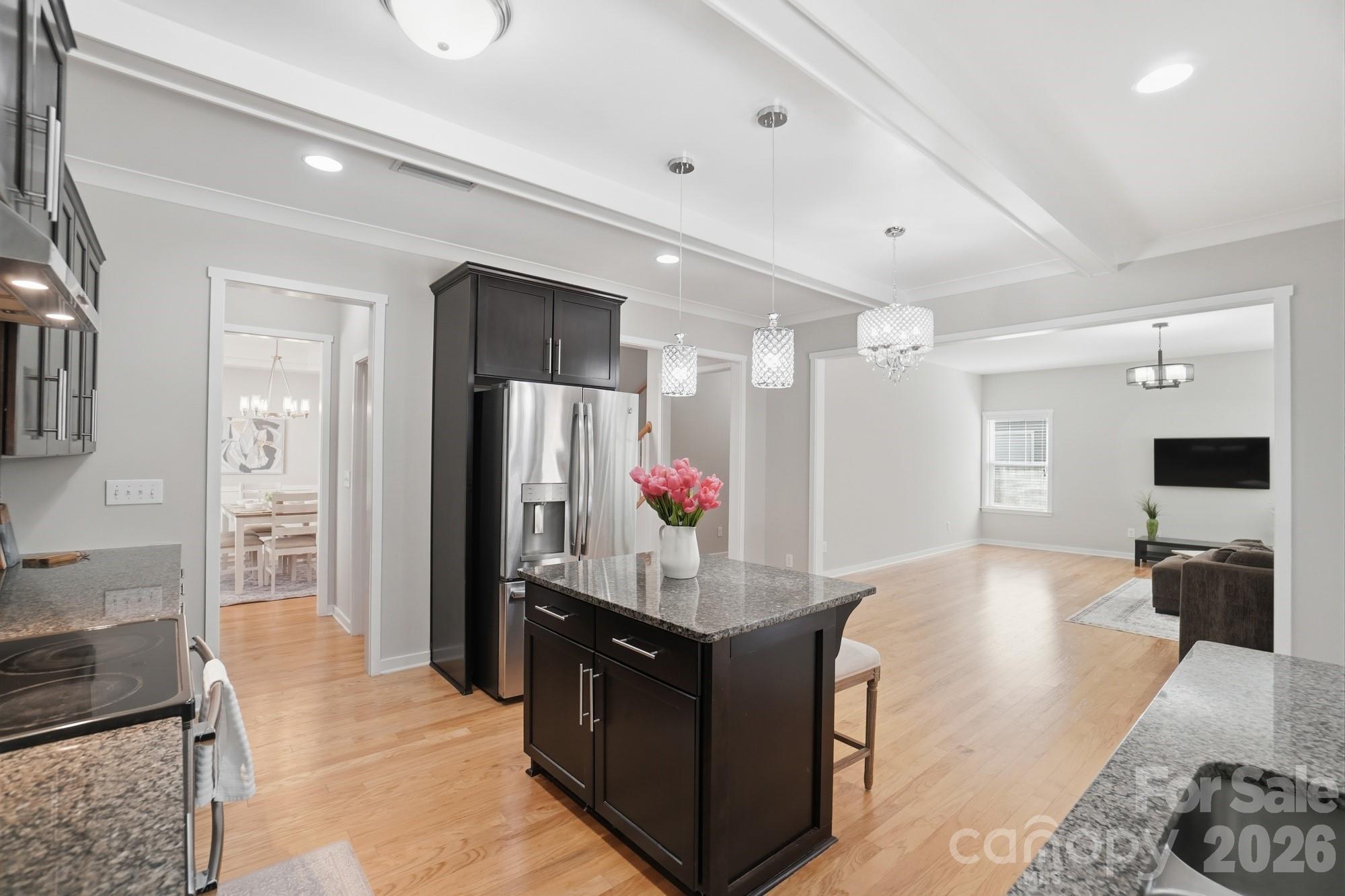 2153 Bluebell Way Tega Cay, SC 29708 - Photo 15 of 48 a living room with stainless steel appliances kitchen island granite countertop furniture and a view of living room