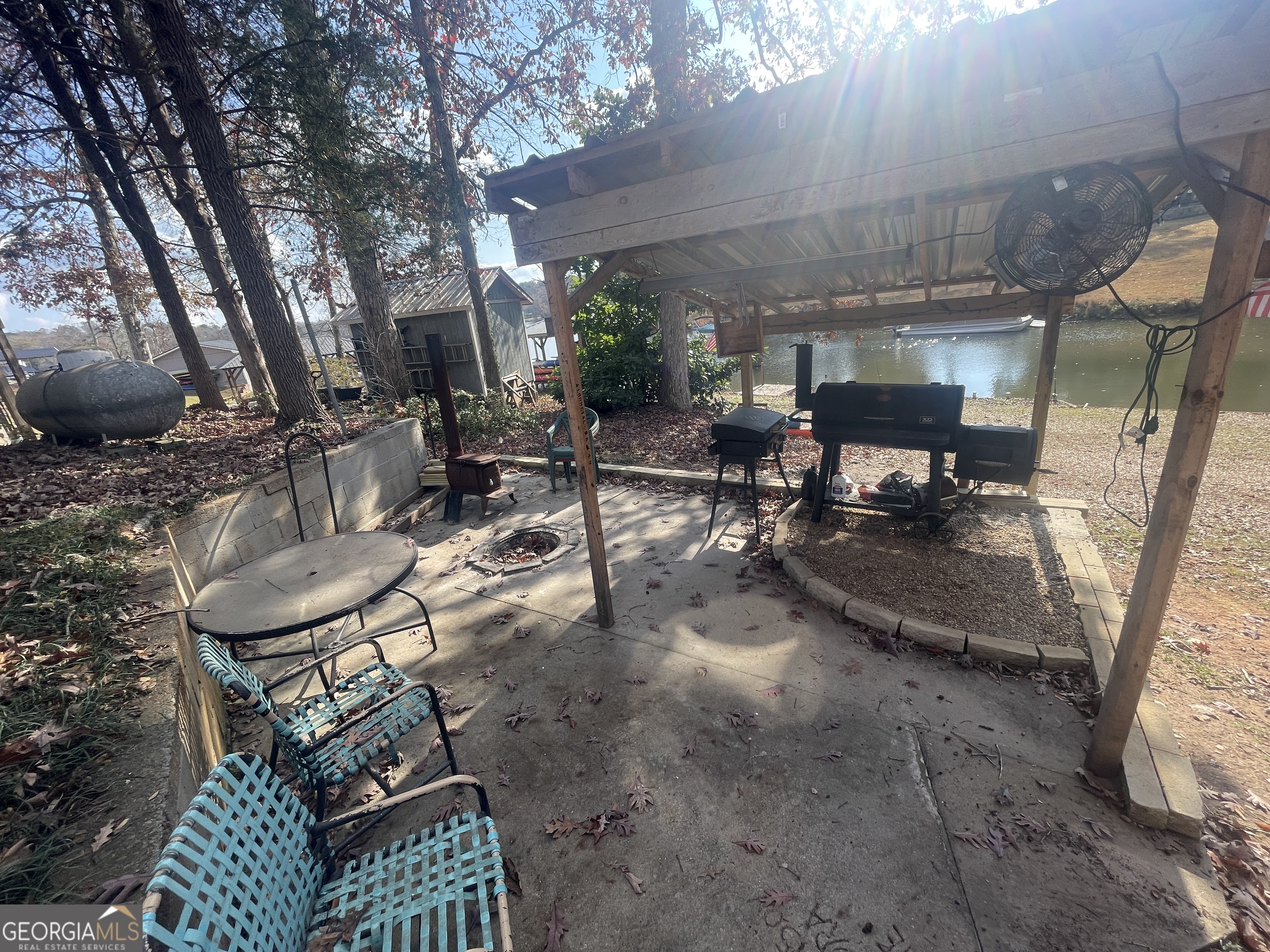 70 Birch Road Covington, GA 30014 - Photo 8 of 23 a view of a patio with table and chairs and potted plants