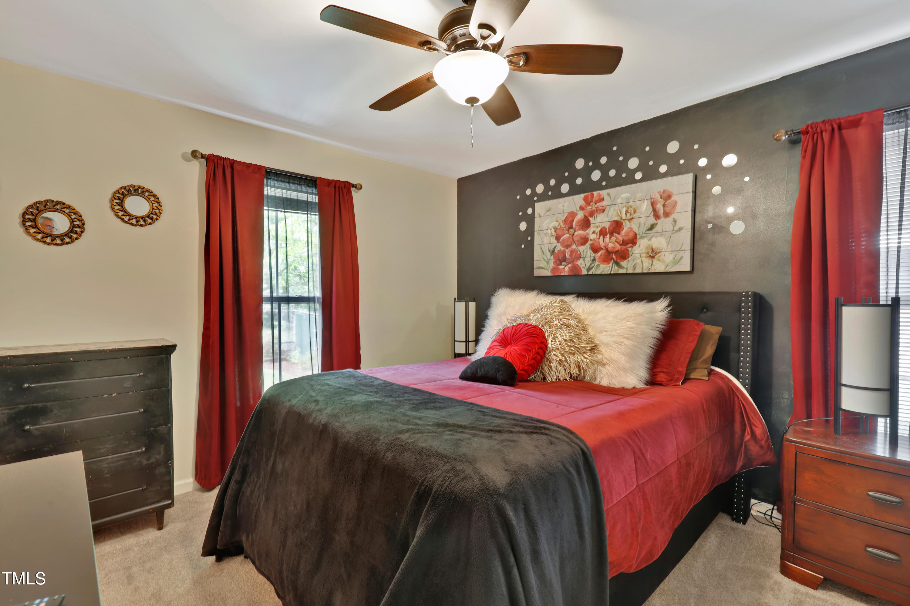 603 East Martin Street Raleigh, NC 27601 - Photo 12 of 25 a bedroom with a bed and a chandelier