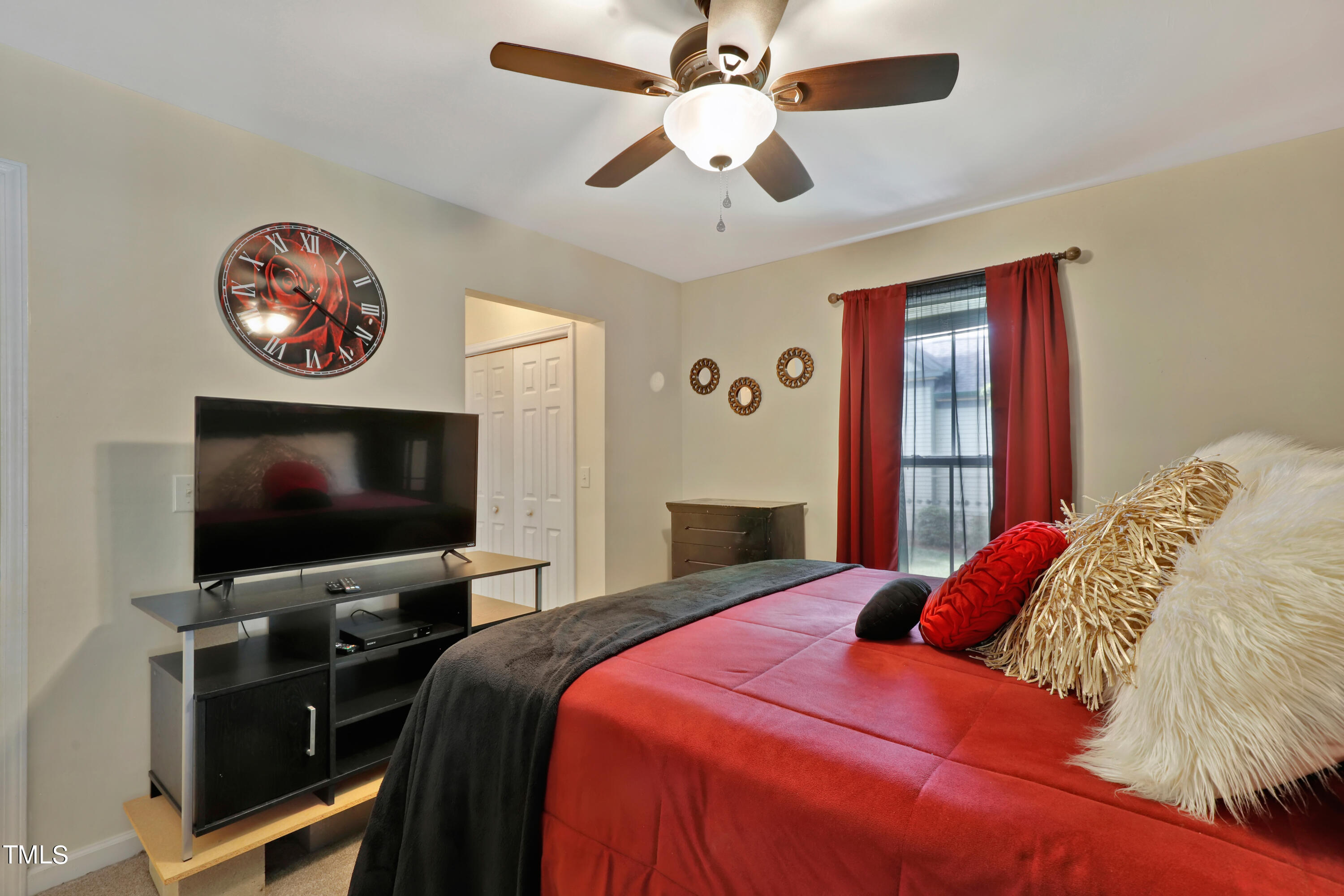 603 East Martin Street Raleigh, NC 27601 - Photo 13 of 25 a bedroom with a bed and a flat screen tv