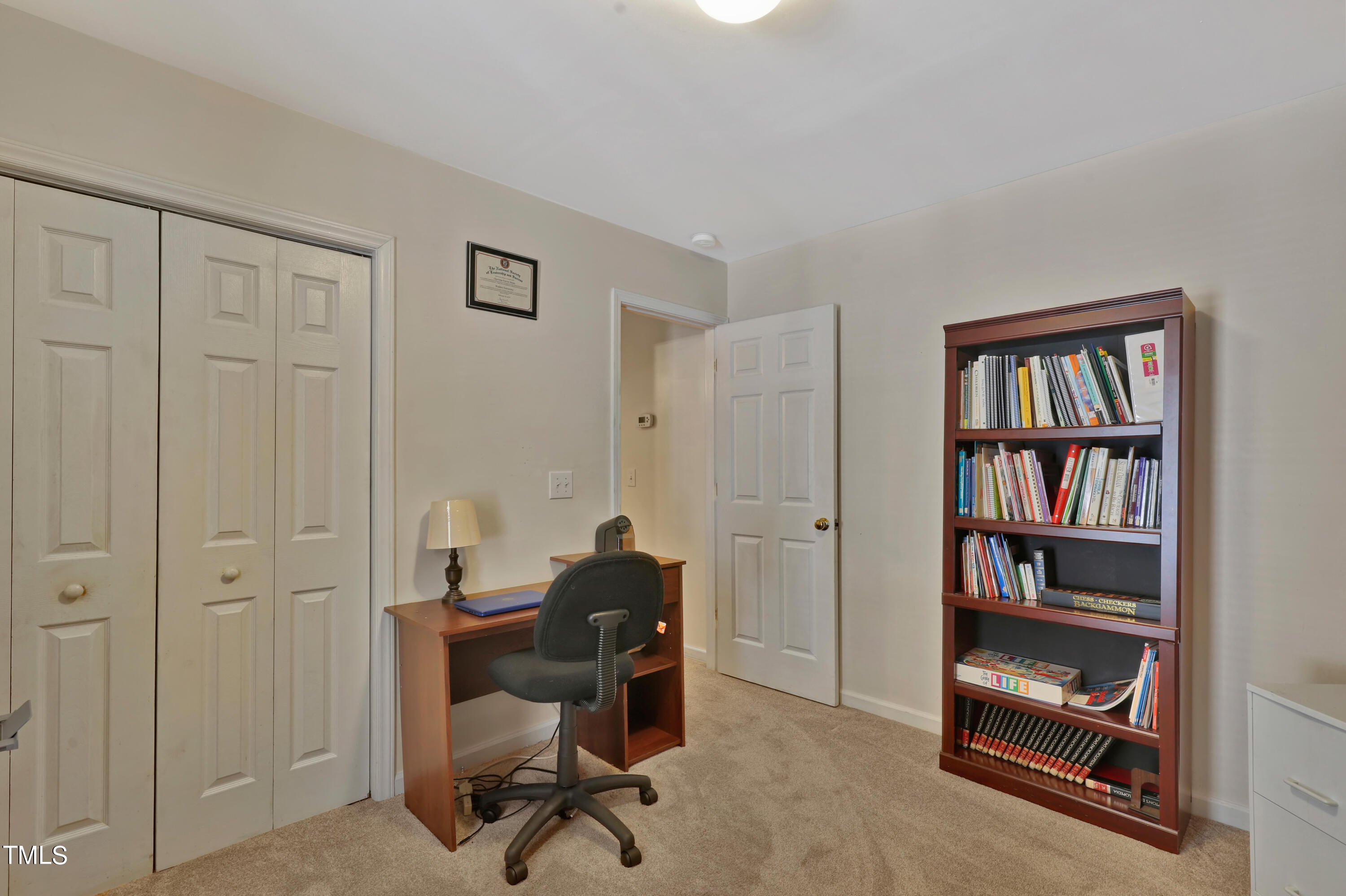 603 East Martin Street Raleigh, NC 27601 - Photo 19 of 25 a view of a workspace with furniture and a bookshelf