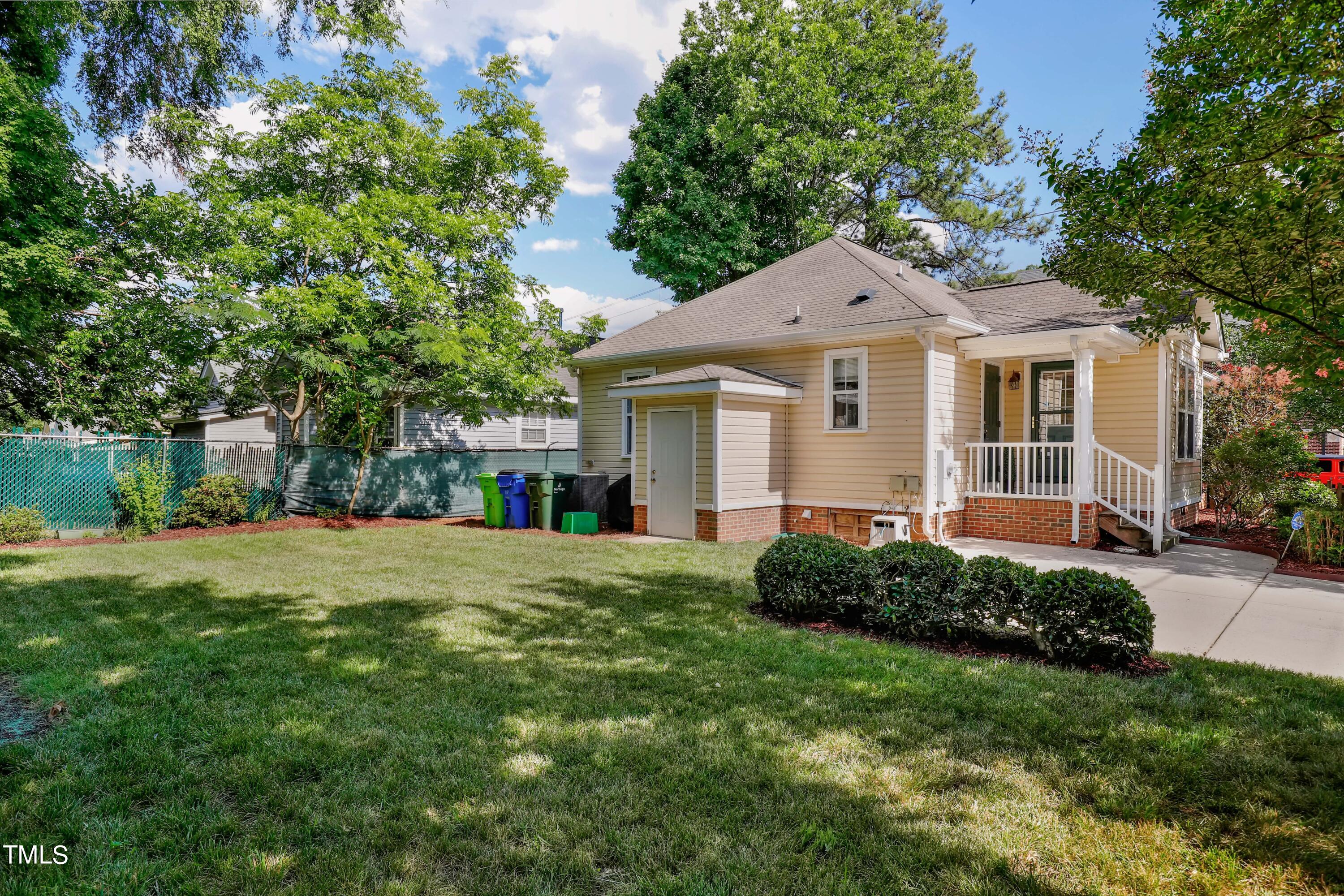 603 East Martin Street Raleigh, NC 27601 - Photo 21 of 25 a front view of a house with a garden