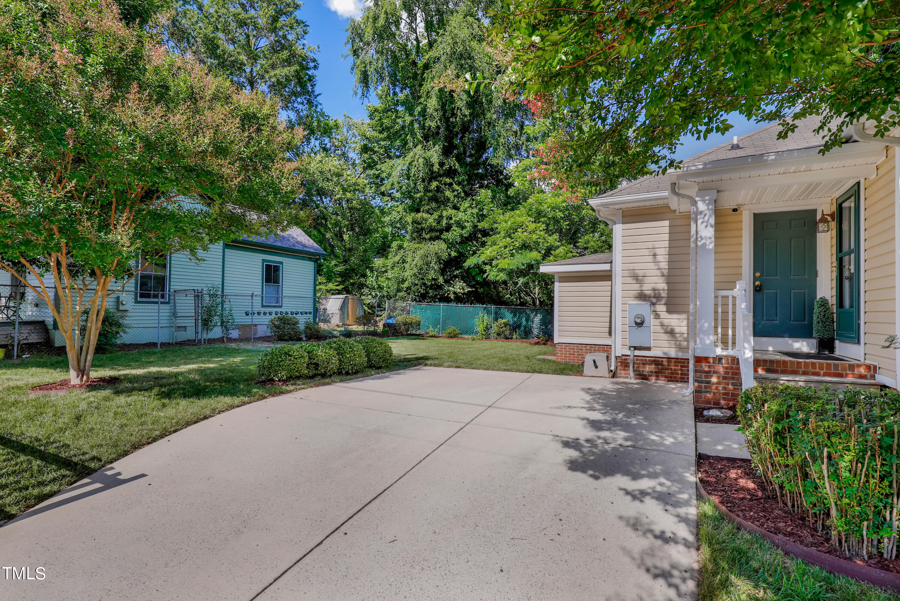 603 East Martin Street Raleigh, NC 27601 - Photo 22 of 25 a view of backyard of house with outdoor seating and green space