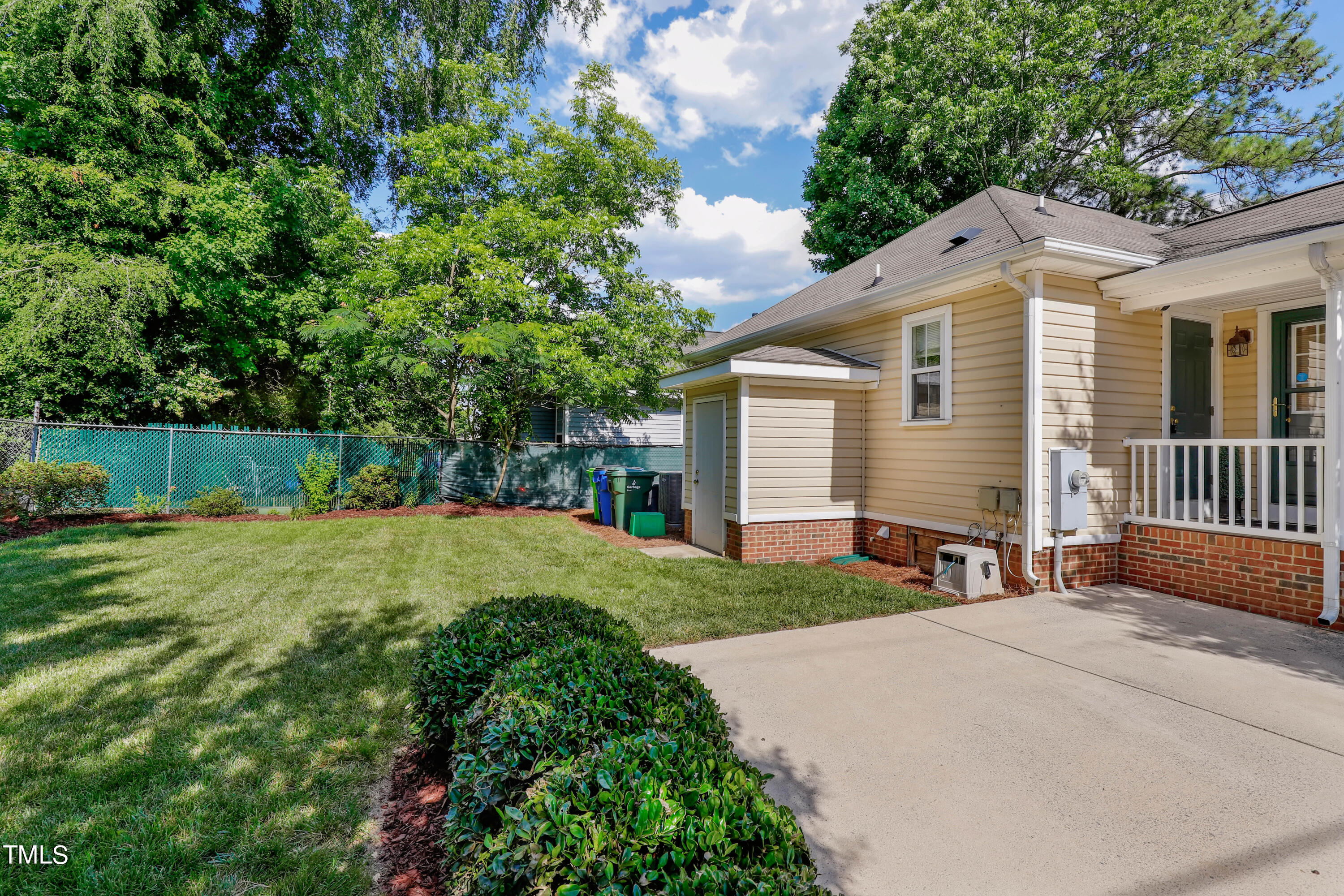 603 East Martin Street Raleigh, NC 27601 - Photo 23 of 25 a front view of a house with a yard and outdoor seating