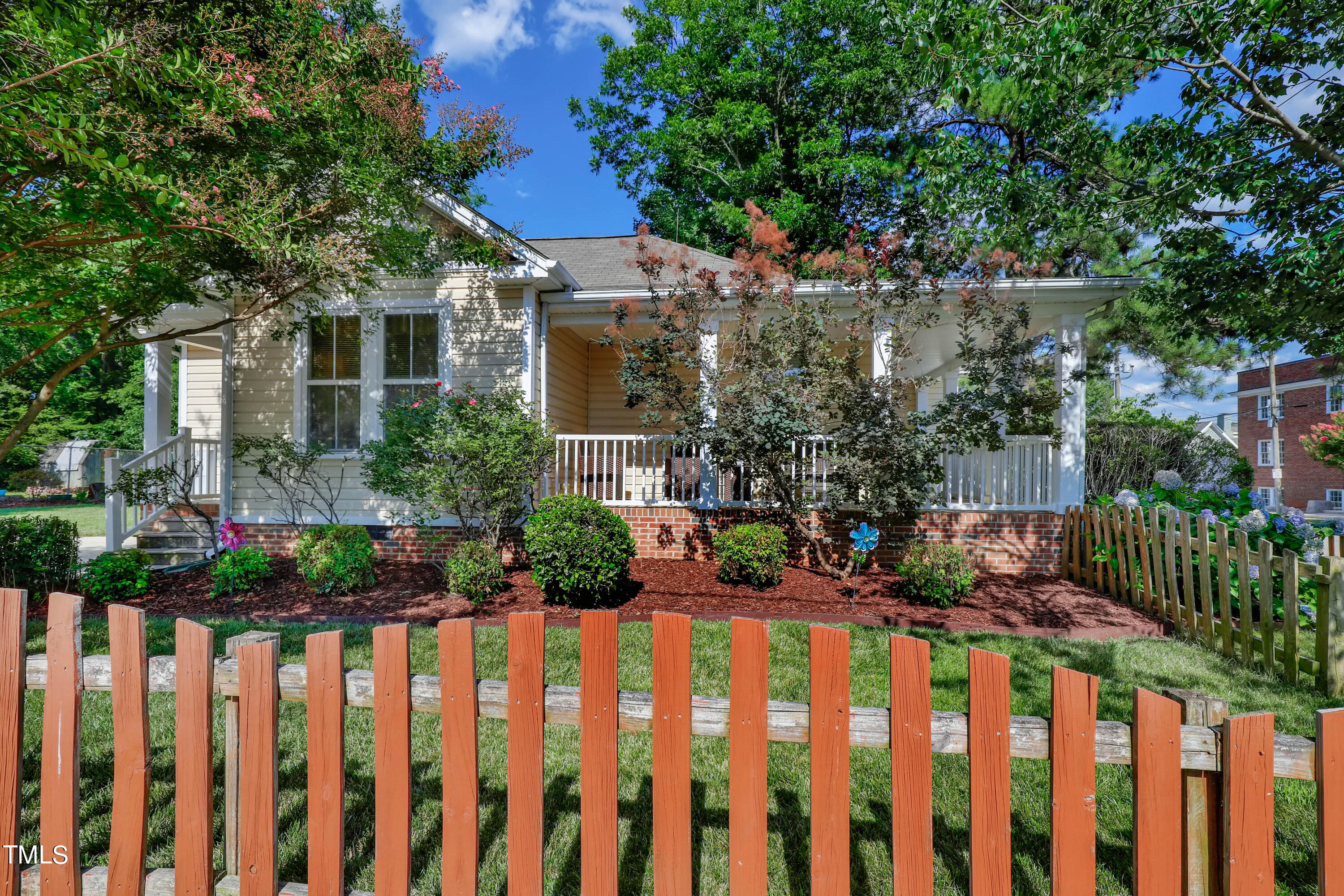 603 East Martin Street Raleigh, NC 27601 - Photo 4 of 25 a front view of a house with a garden