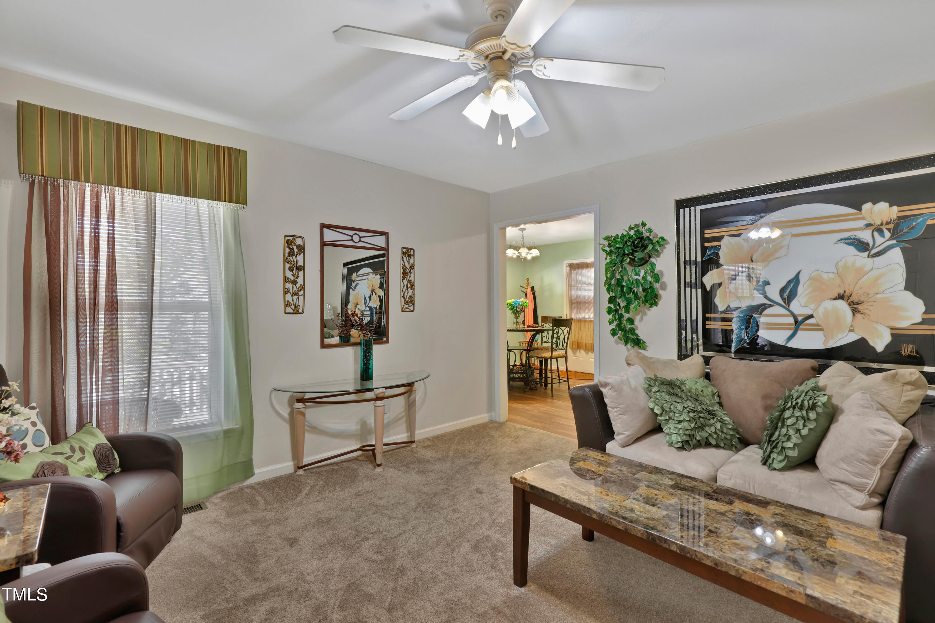 603 East Martin Street Raleigh, NC 27601 - Photo 6 of 25 a living room with furniture and a large window