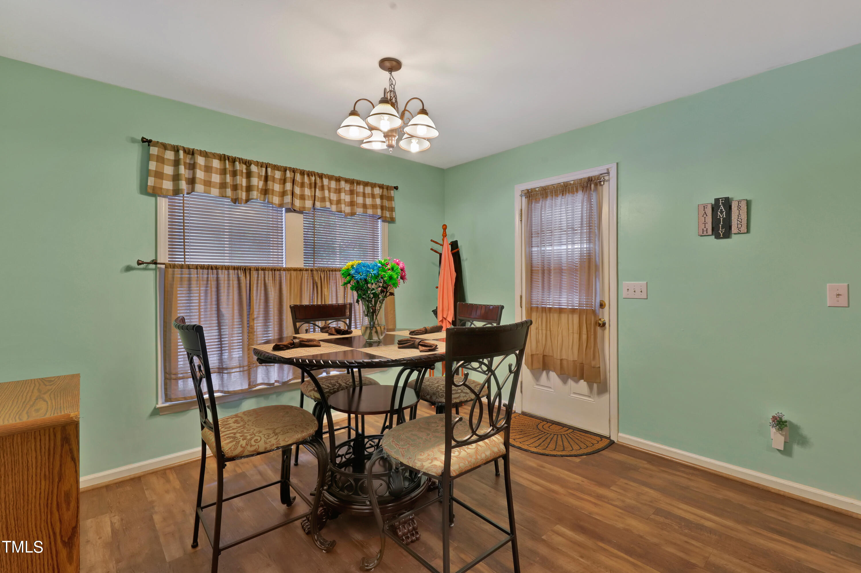 603 East Martin Street Raleigh, NC 27601 - Photo 9 of 25 a view of a dining room with furniture and chandelier