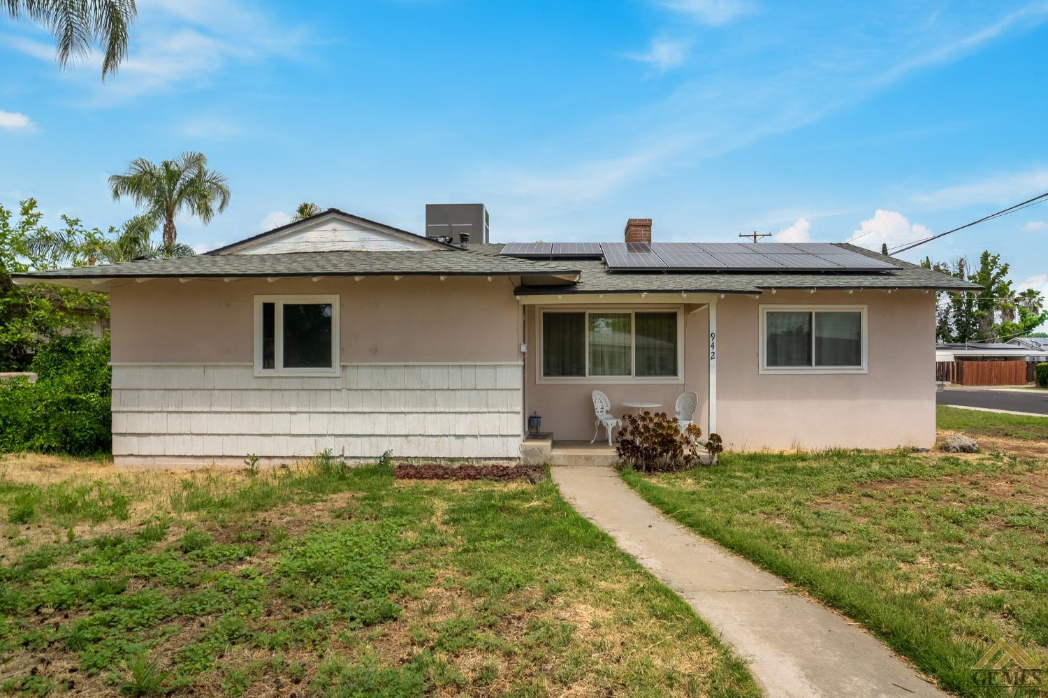 Undisclosed Address Wasco, CA 93280 - Photo 1 of 30 a front view of a house with a yard