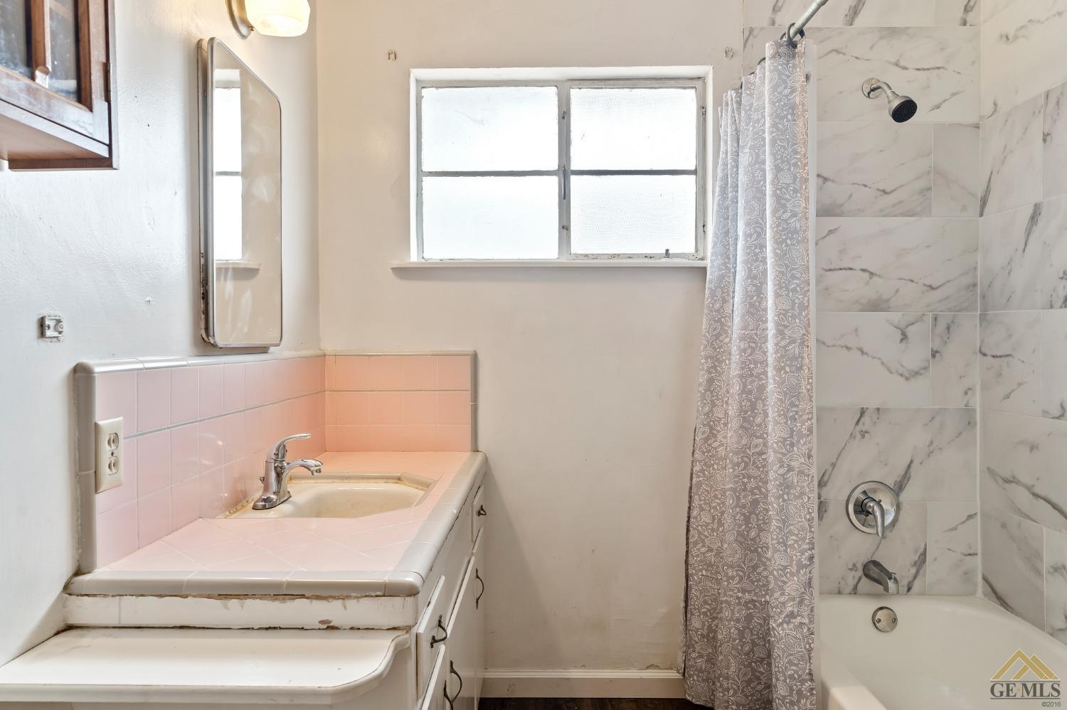 Undisclosed Address Wasco, CA 93280 - Photo 17 of 30 a bathroom with a sink and a mirror