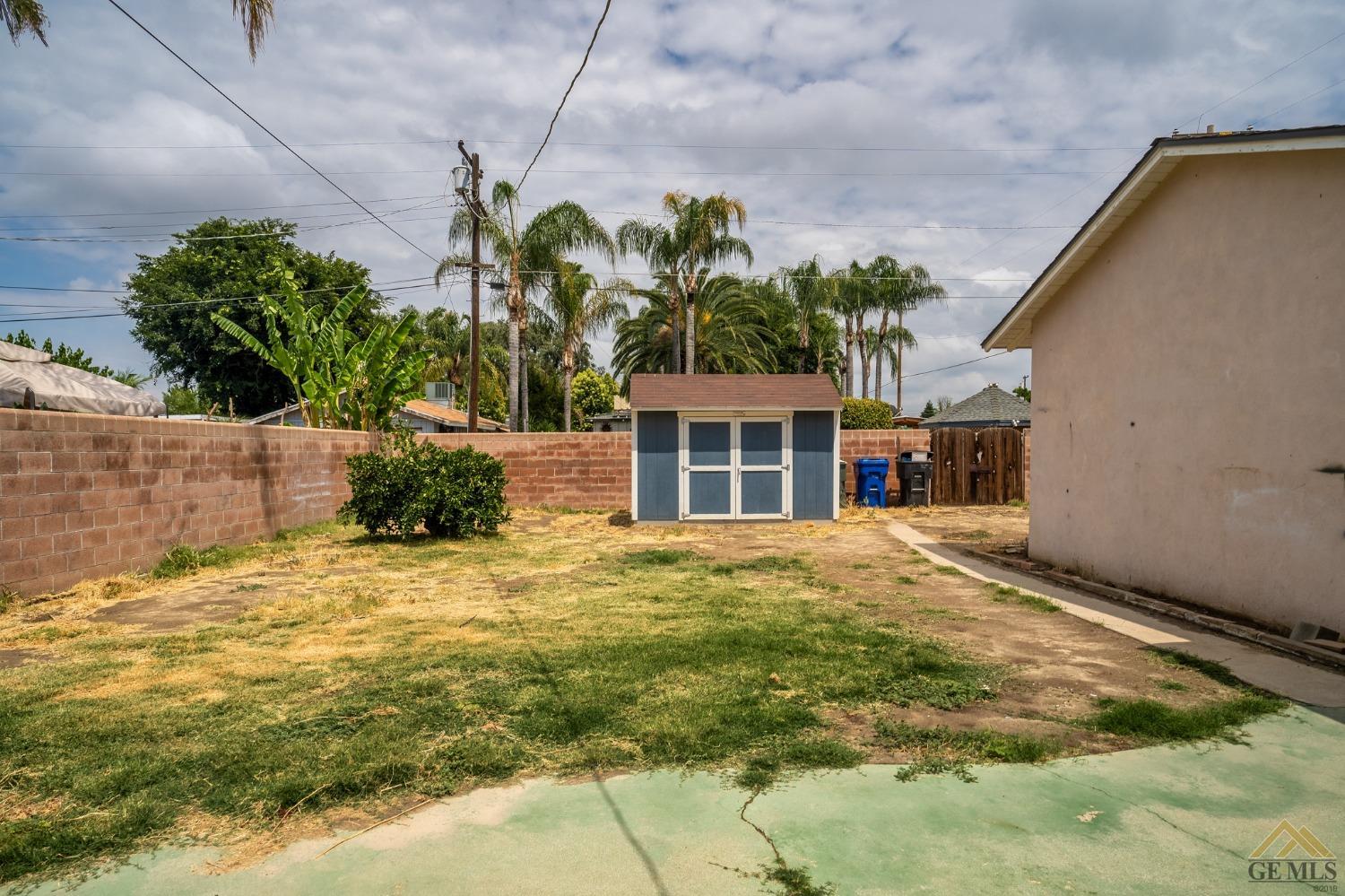 Undisclosed Address Wasco, CA 93280 - Photo 26 of 30 a front view of a house with a yard