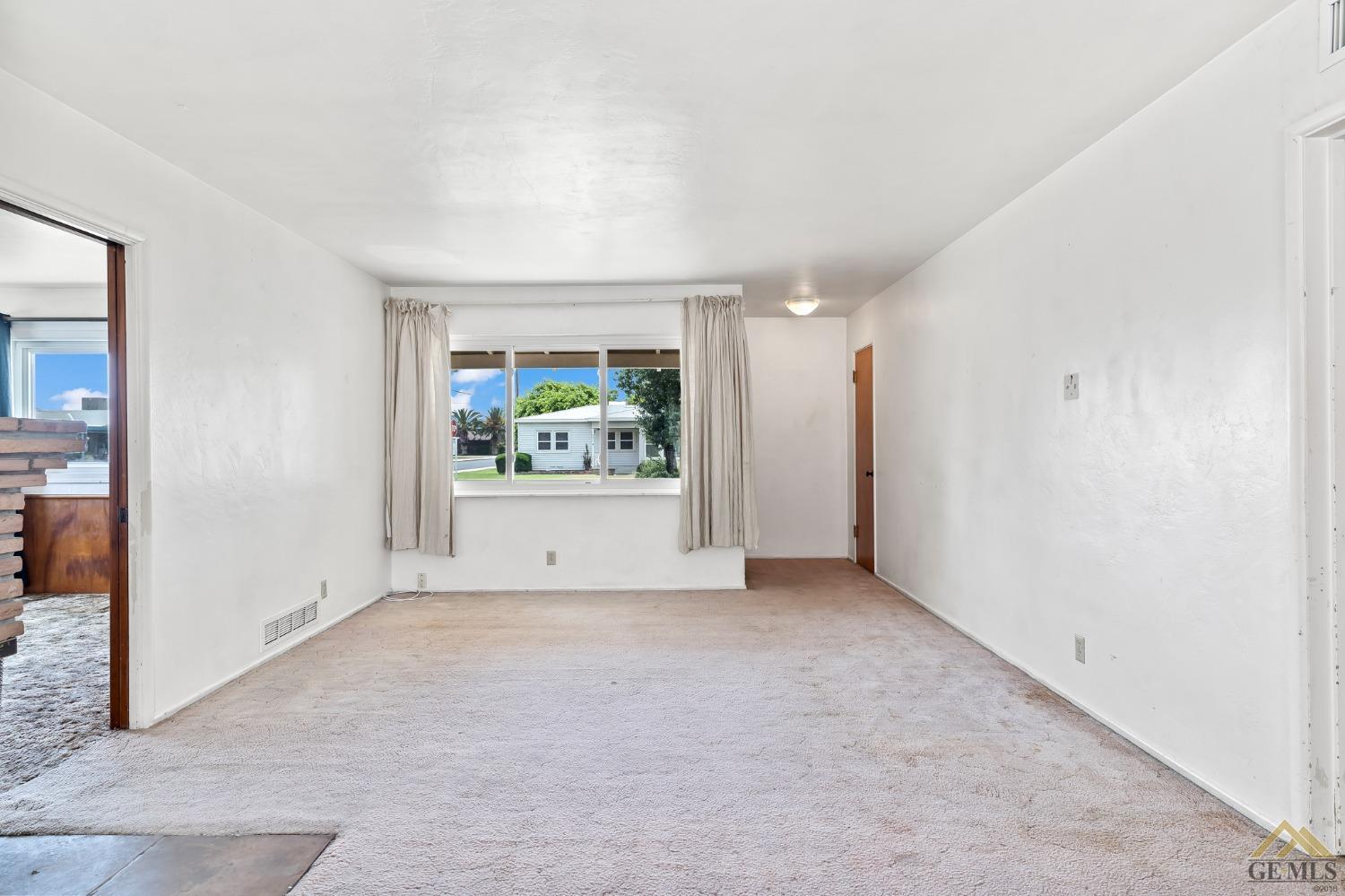 Undisclosed Address Wasco, CA 93280 - Photo 10 of 30 an empty room with windows and closet