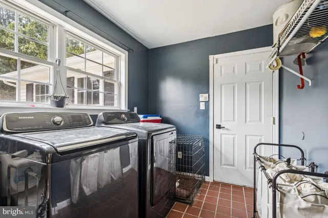 a view of a kitchen with a sink and cabinets