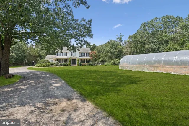 a view of garden with trees and grass