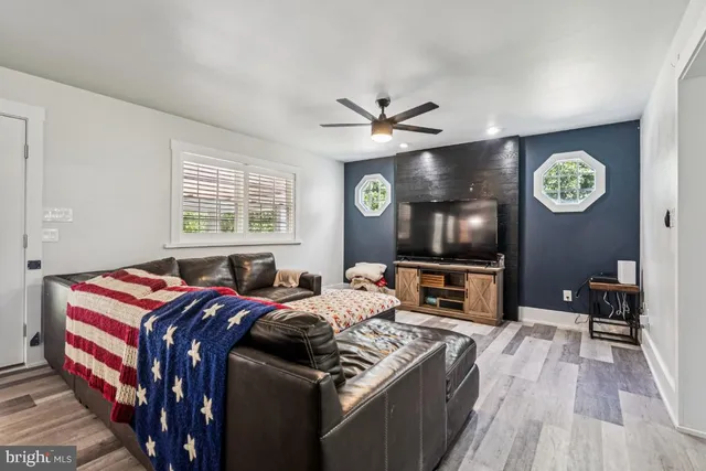 a bedroom with furniture and a flat screen tv