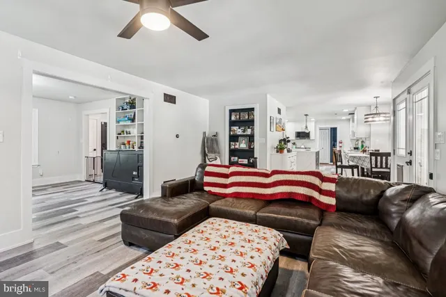 a bedroom with a bed and ceiling fan
