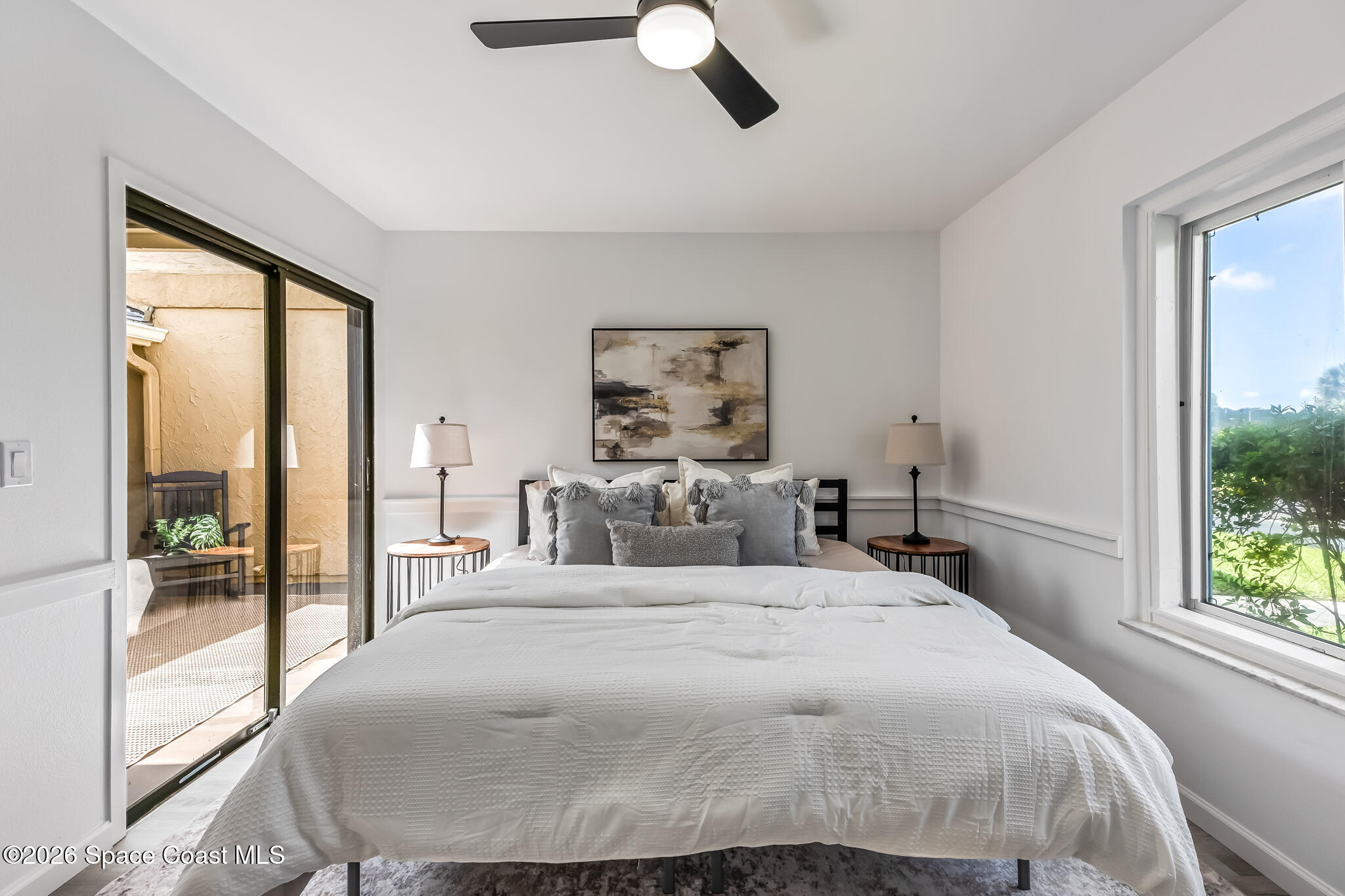 1411 Sheafe Avenue Northeast, Unit 101 Palm Bay, FL 32905 - Photo 12 of 24 a bedroom with a large bed and a large window