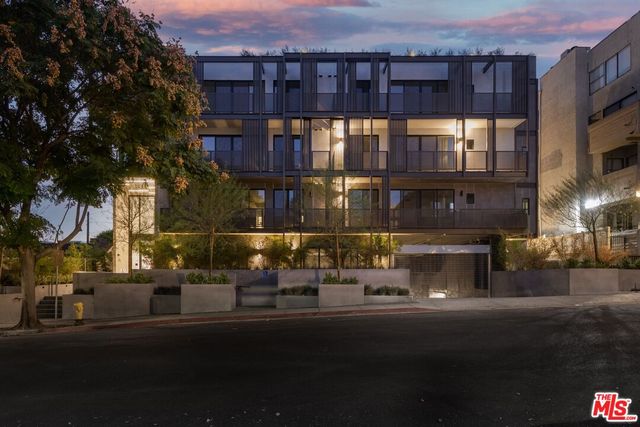 a front view of a building with street view