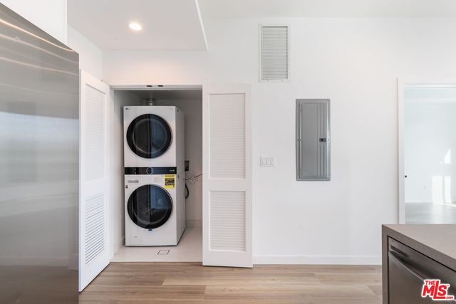 a view of a hallway with washer and dryer