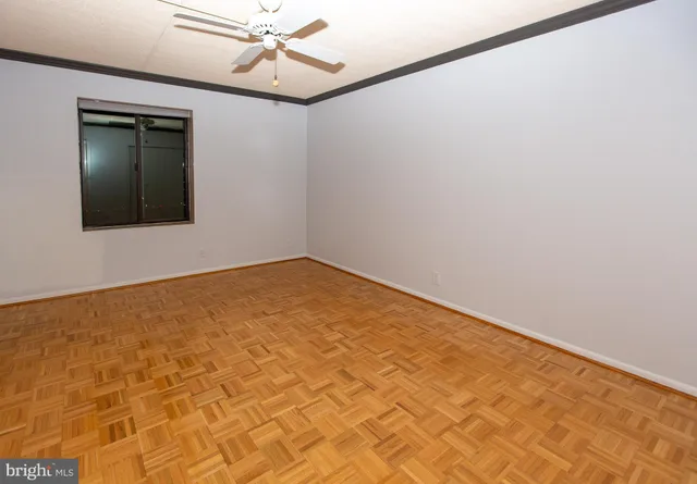 a kitchen with a refrigerator and cabinets