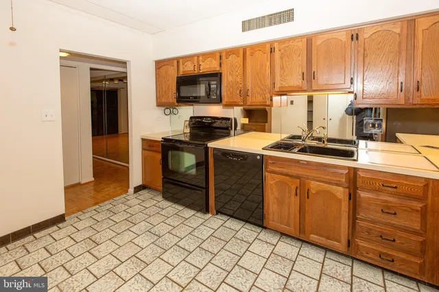 a living room with furniture and large window