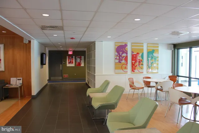 a patio with a table and chairs under an umbrella