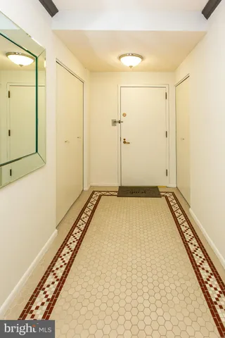 a view of a room with wooden floor