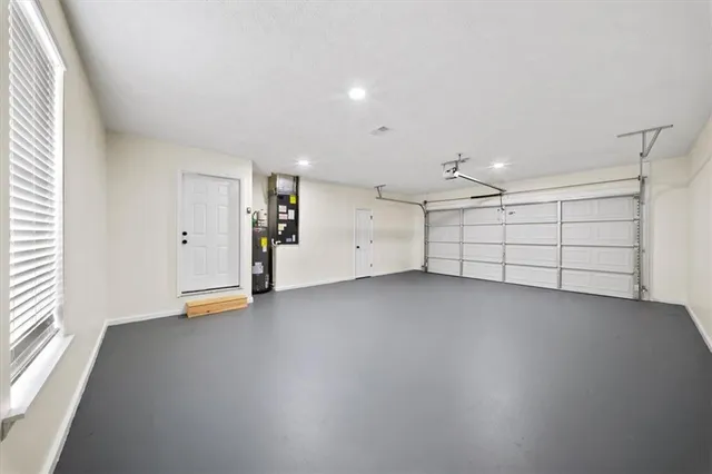 an empty room with a empty space and windows