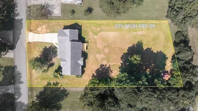 an aerial view of a residential apartment building with a yard