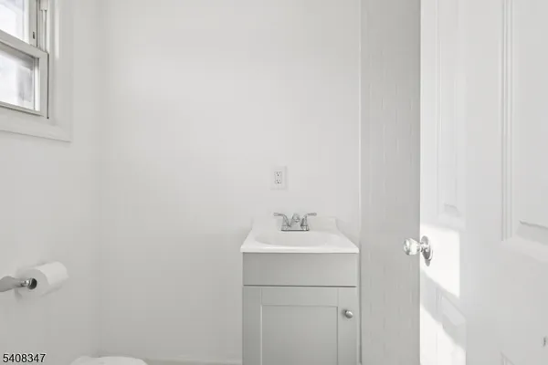 a bathroom with a sink and vanity