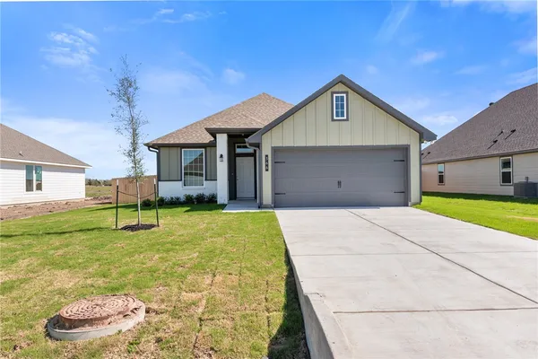 a view of an house with backyard and porch