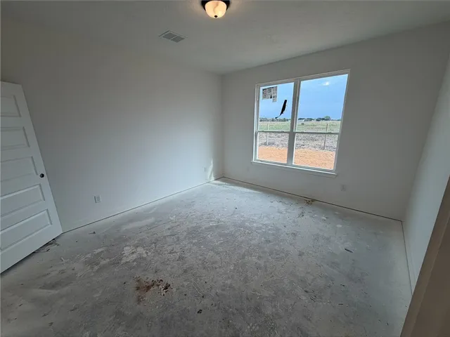 an empty room with windows
