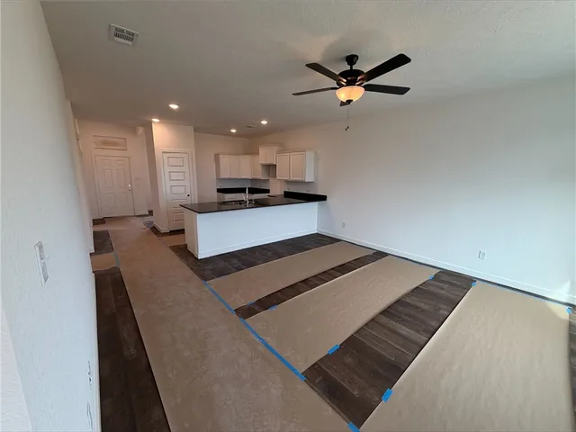 a view of hallway with windows