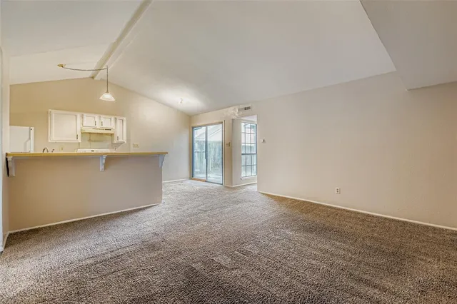 a view of a kitchen with a sink and cabinets
