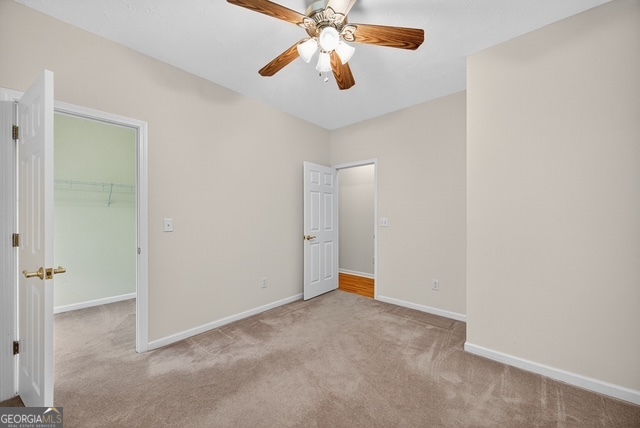 611 Moncrief Road Roberta, GA 31078 - Photo 19 of 30 a view of an empty room and chandelier fan