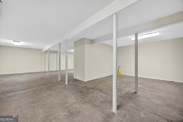 a view of a room with wooden walls