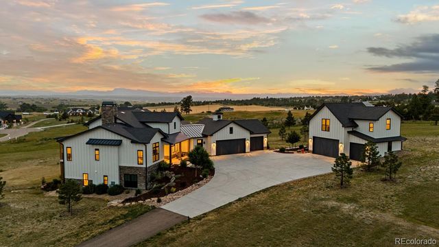 an aerial view of a house with a mountain view