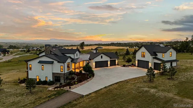 an aerial view of a house with a mountain view