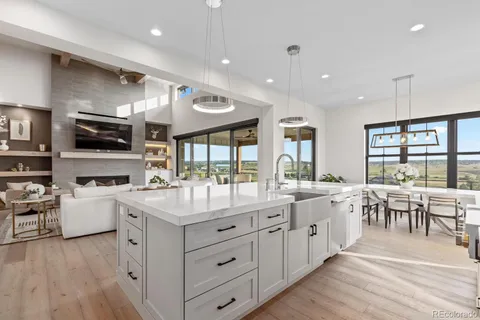a kitchen with sink cabinets and wooden floor