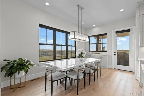a kitchen with stainless steel appliances granite countertop a stove refrigerator and cabinets