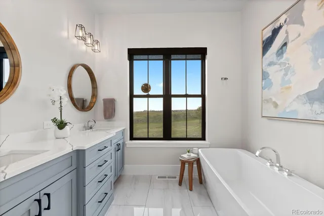 a spacious bathroom with a shower sink and mirror