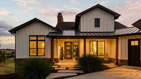a view of living room kitchen and entryway