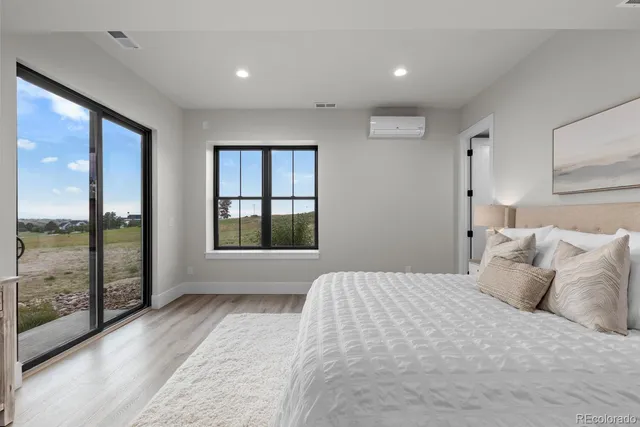 a bathroom with a double vanity sink toilet and shower