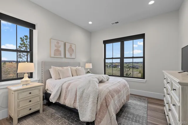 a bathroom with a sink toilet vanity tub and shower