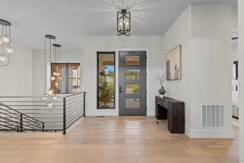 a living room with fireplace furniture and a flat screen tv