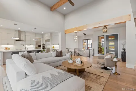 a living room with fireplace furniture and a flat screen tv