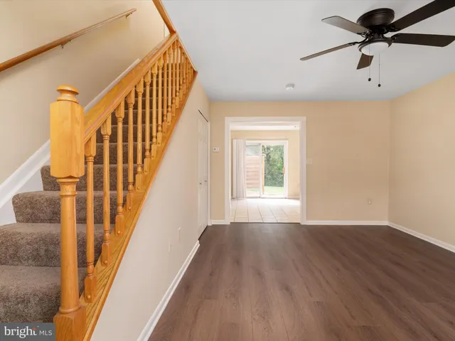a view of an entryway with wooden floor