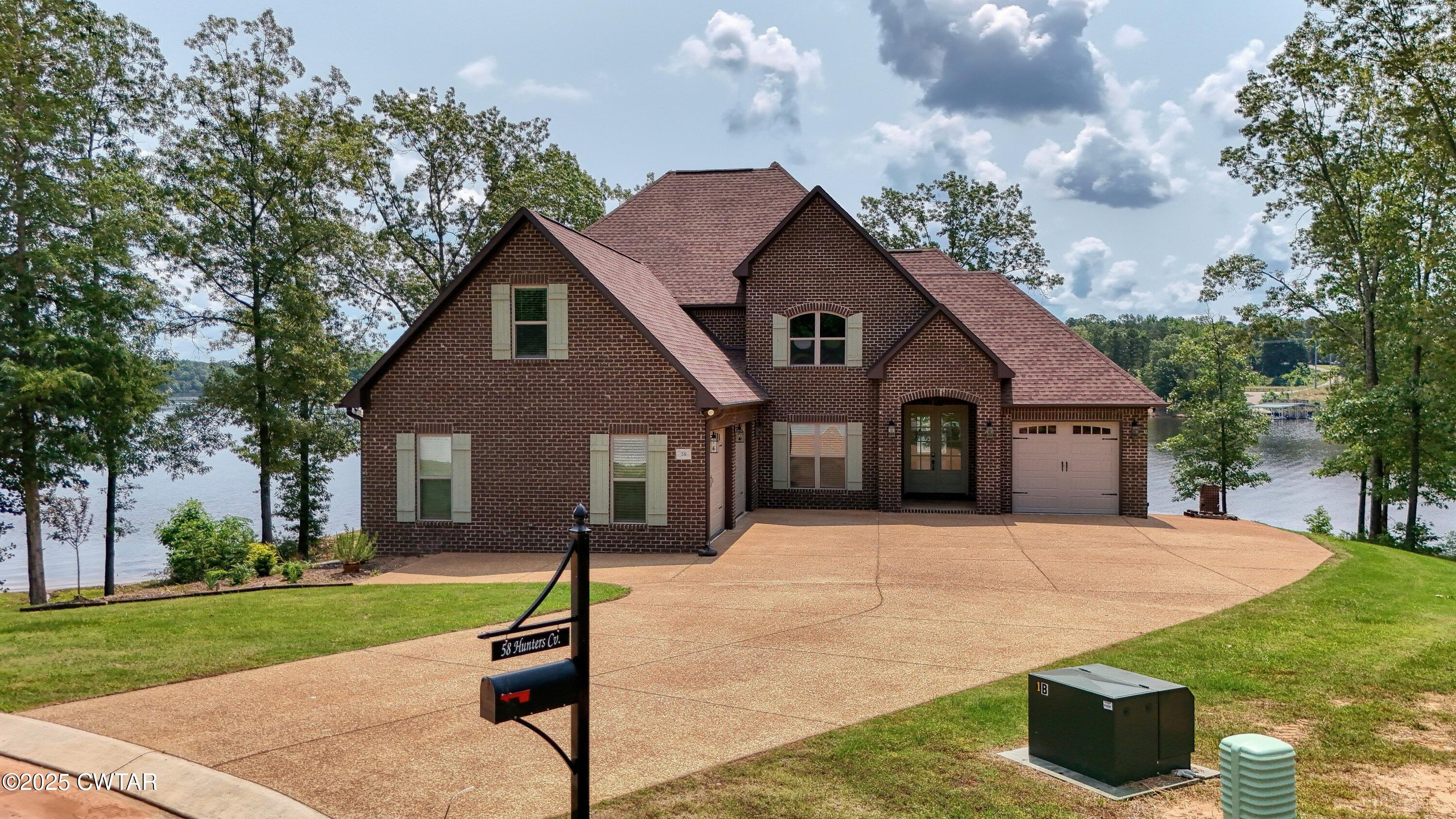 58 Hunters Cove Huntingdon, TN 38344 - Photo 1 of 40 DJI_20250602114651_0296_D