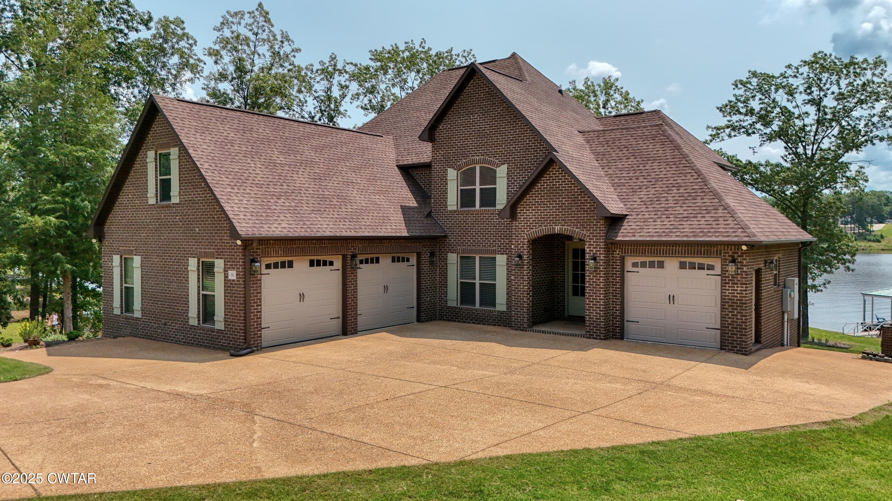 58 Hunters Cove Huntingdon, TN 38344 - Photo 3 of 40 DJI_20250602114501_0293_D