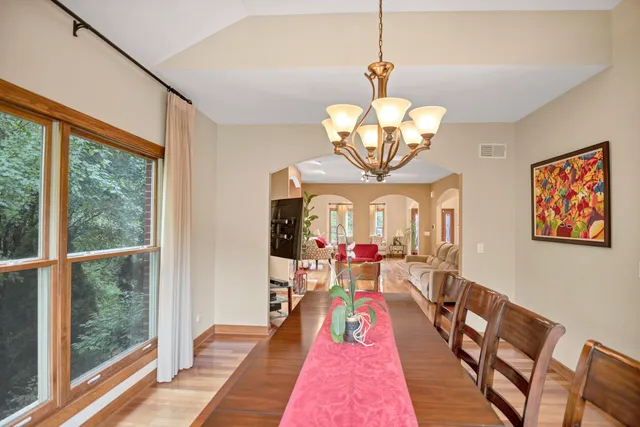 a kitchen with stainless steel appliances granite countertop a sink and a refrigerator