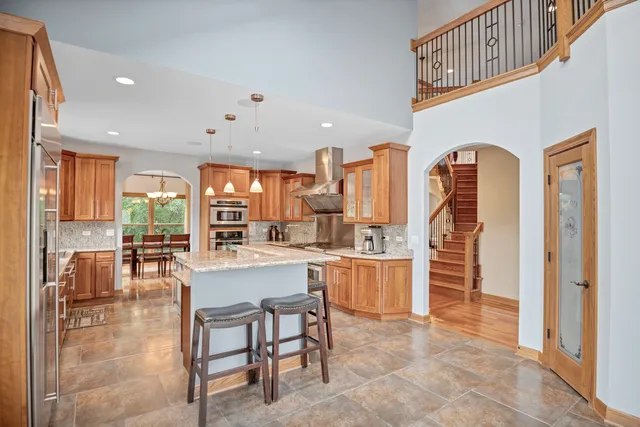 a bedroom with two beds and a large window